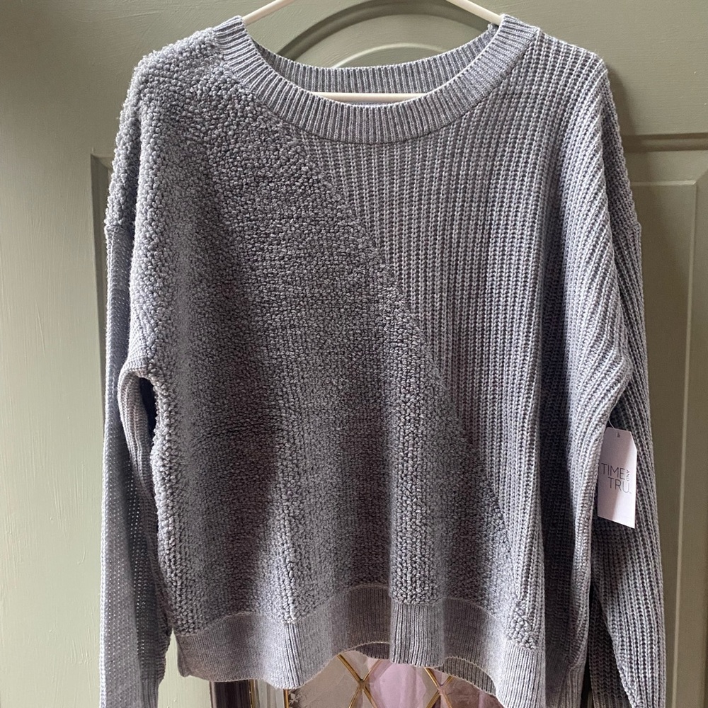 Brand new with tags, women’s XL fall sweater. Shorter length